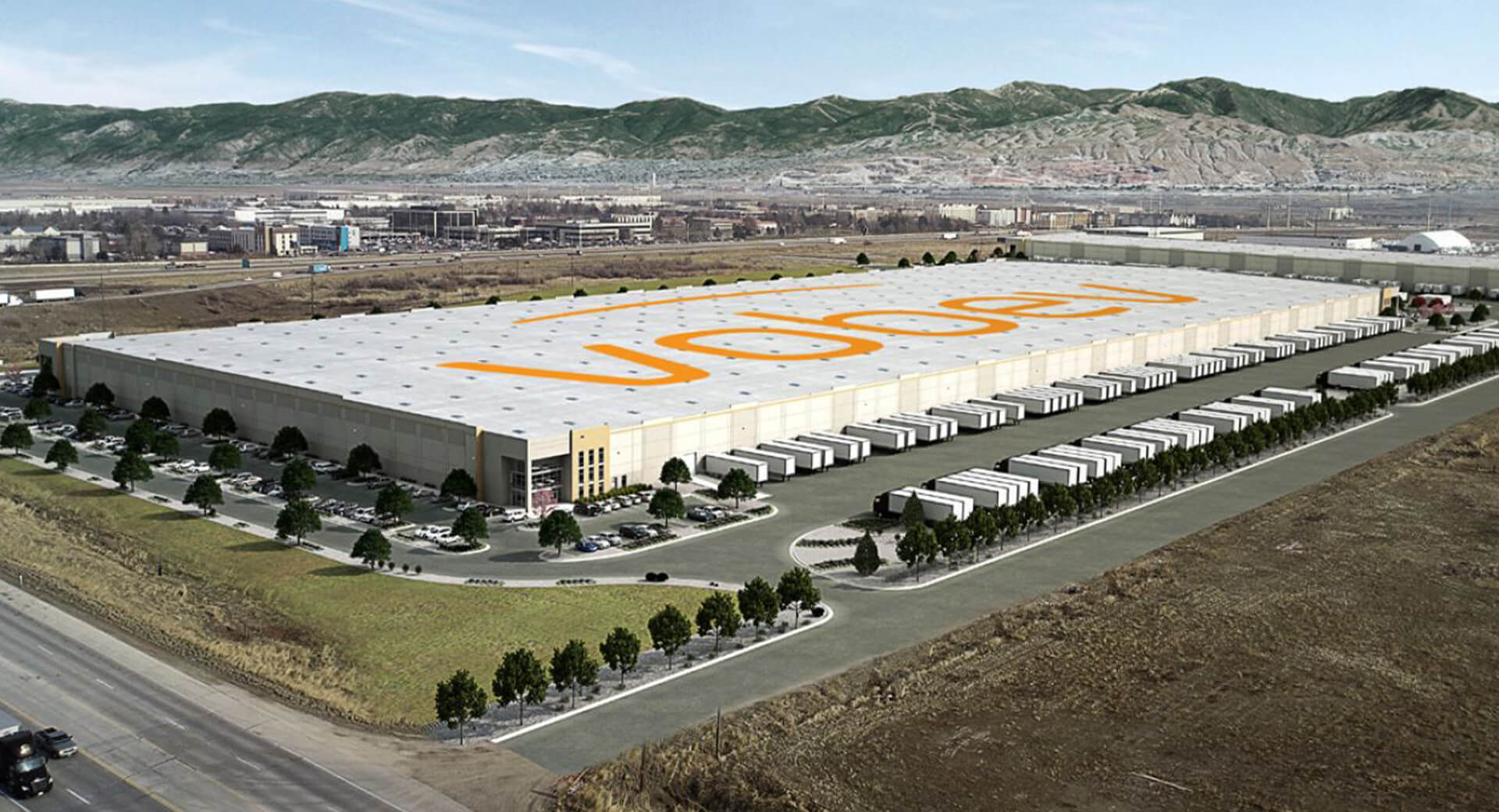 An aerial view of the Vobev facility.  Large building with the word "Vobev" printed in orange on the roof.