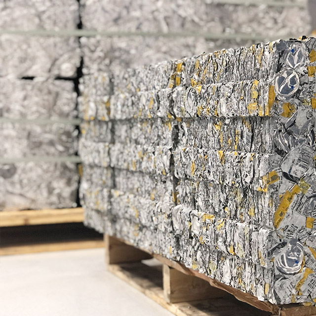 Pallets of crushed cans.