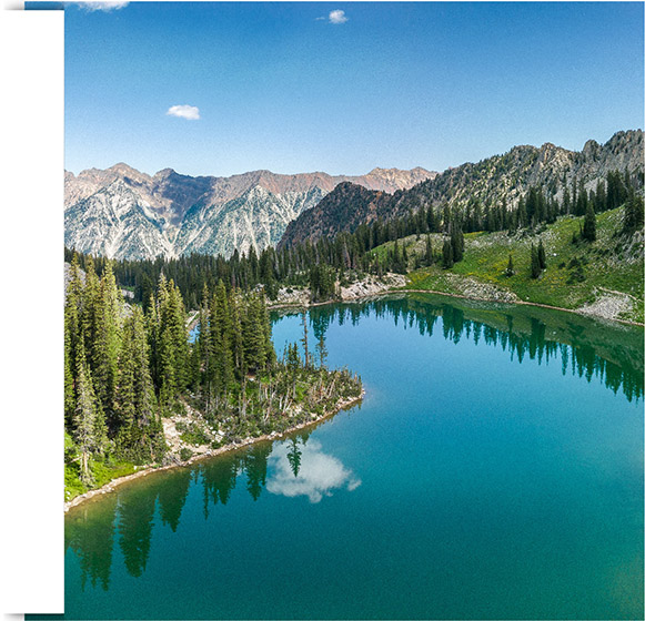 Beautiful bright blue alpine lake nestled in the Wasatch Mountains